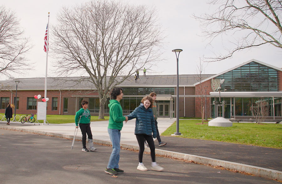 Students walking past main entrance at Lincoln School in Massachusetts
