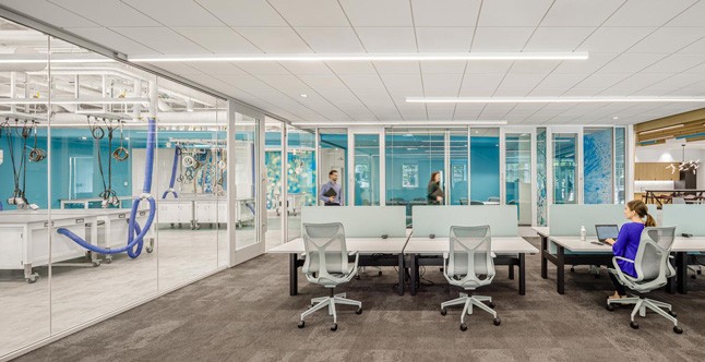 Glass wall separating lab and office space at Waters IMMERSE in Cambridge, MA