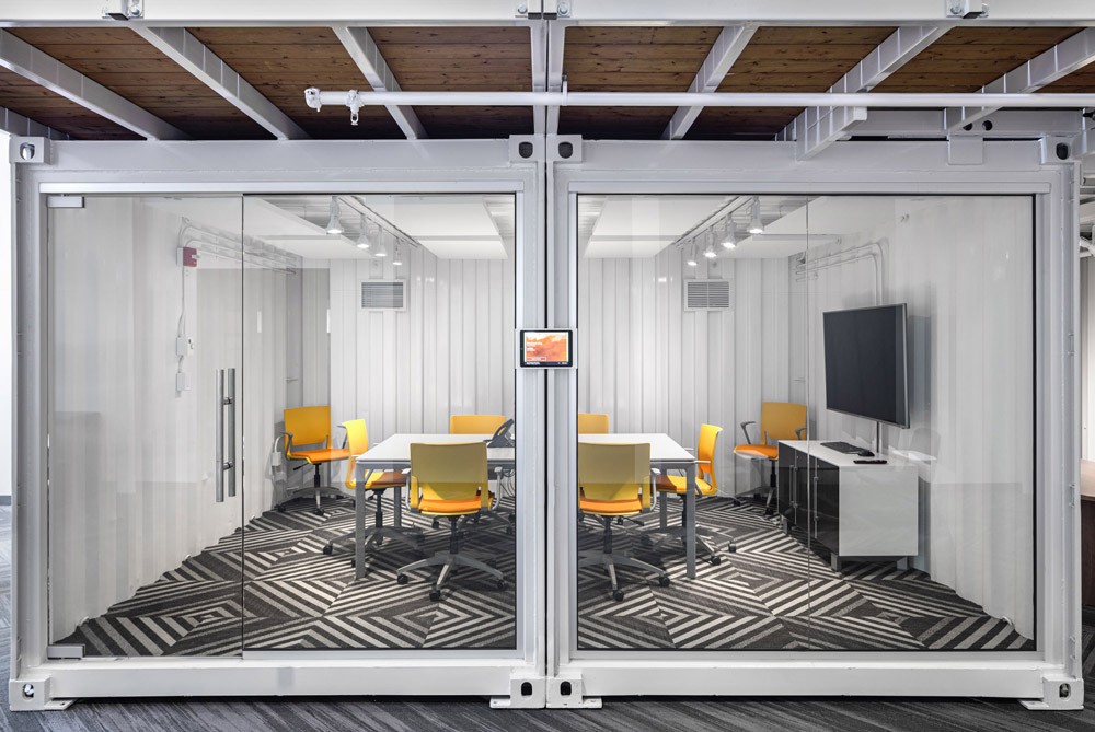 Meeting room inside a shipping container in a marketing agency office
