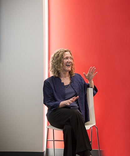 SMMA interior design director Marie Fitzgerald on stage at an event