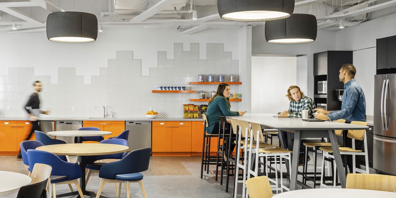 Employees mixing in a workplace cafe at Cambridge Mobile Telematics HQ